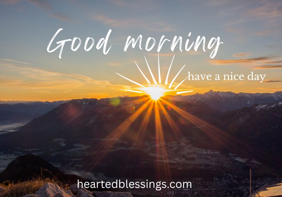 Good morning blessings sunrise image with have a nice day message over mountain landscape with golden sun rays and peaceful dawn sky