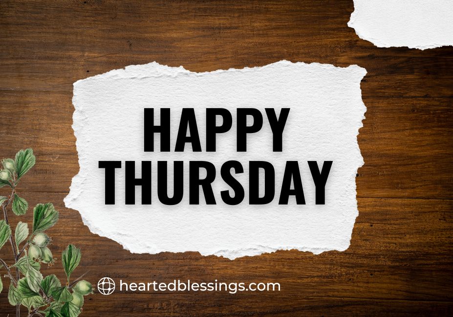 "Happy Thursday blessings text on torn white paper with wooden background and green leaves"